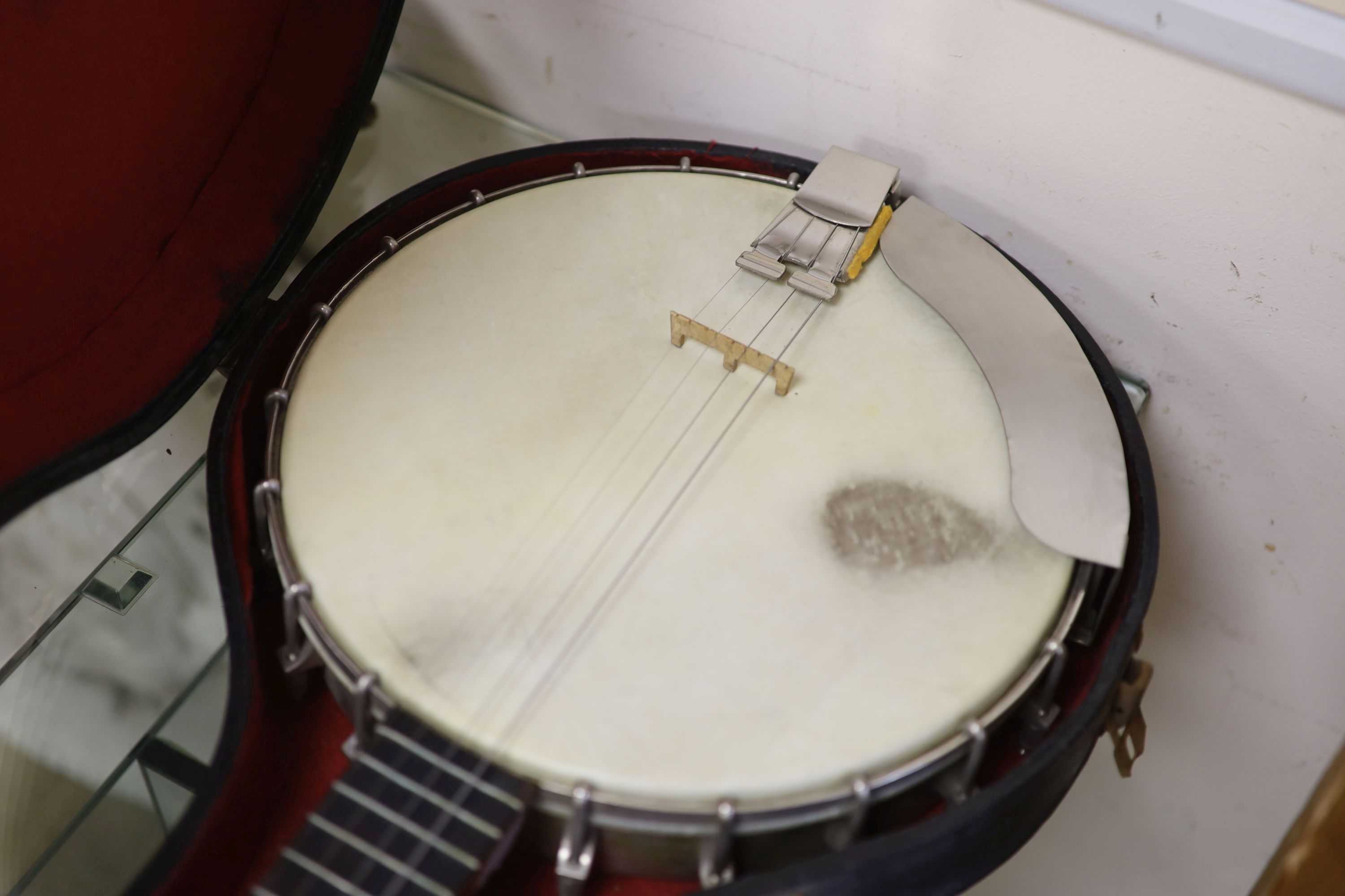 A Windsor popular 4 string banjo, cased
